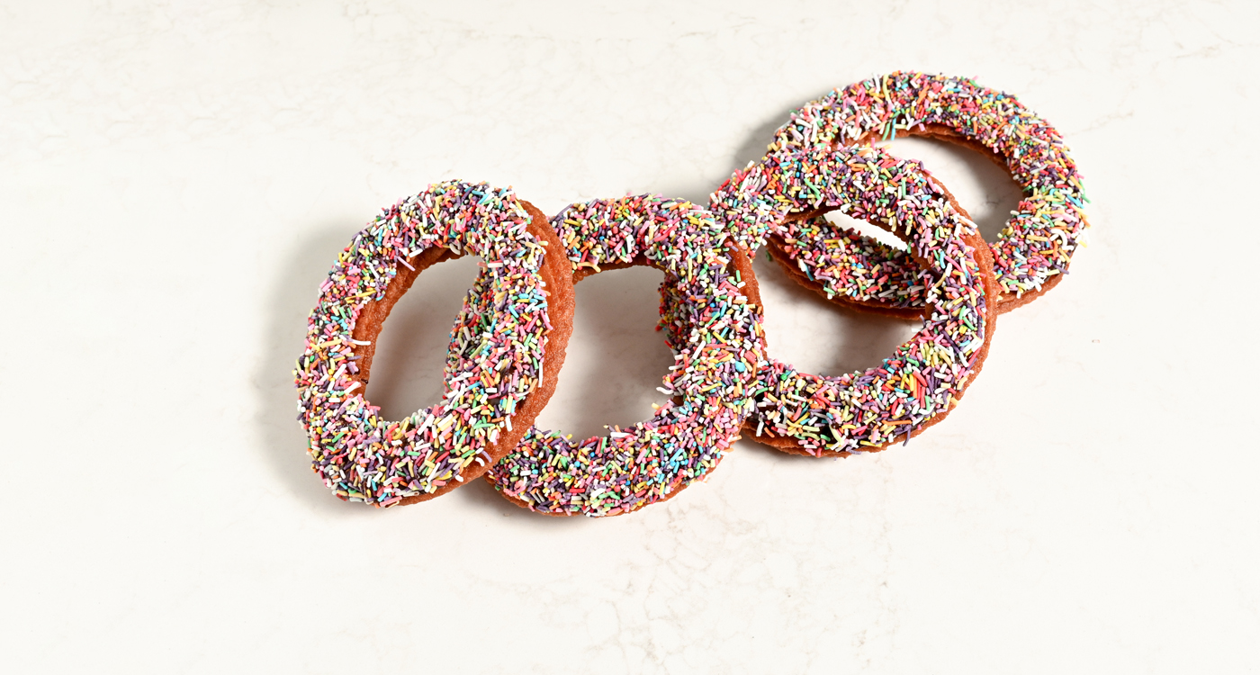 A flat lay style image of four ring Turkish donuts. 