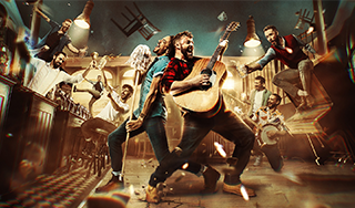 Image of men in an old pub drink, dancing and singing. Two men are standing in the centre off the pub, one is holding a mop and singing into it like a microphone, the other man is singing and plating the guitar. 