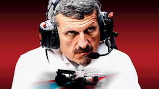 Guenther Steiner with headphones on. 